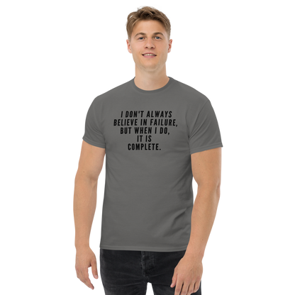 "I don't always believe in failure, but when I do, it is complete." printed on a charcoal unisex classic tee worn by a male