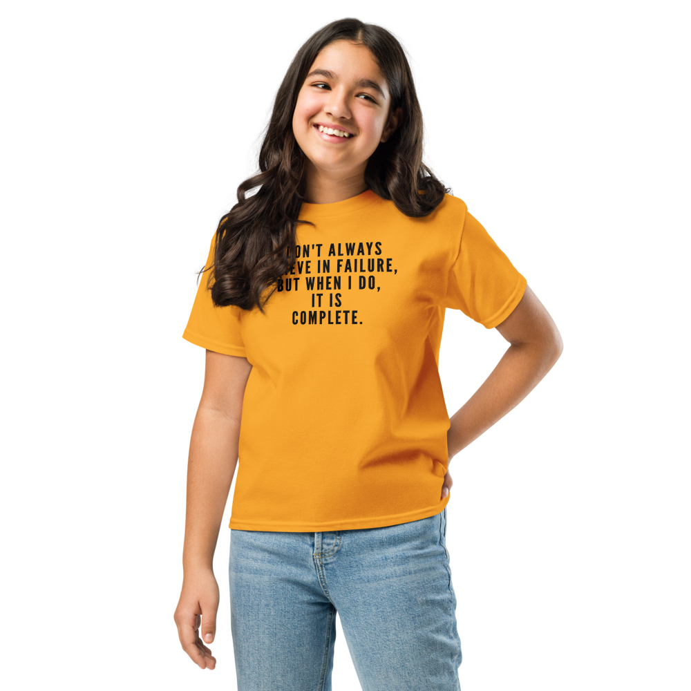 "I don't always believe in failure, but when I do, it is complete." printed on a gold youth classic tee worn by a female