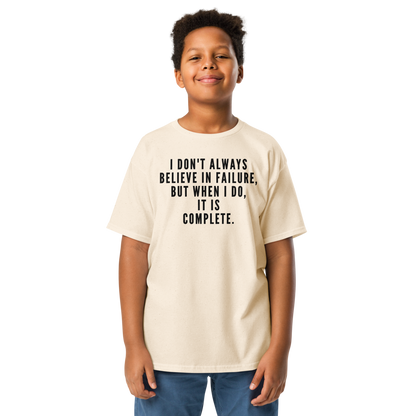 "I don't always believe in failure, but when I do, it is complete." printed on a natural youth classic tee worn by a male