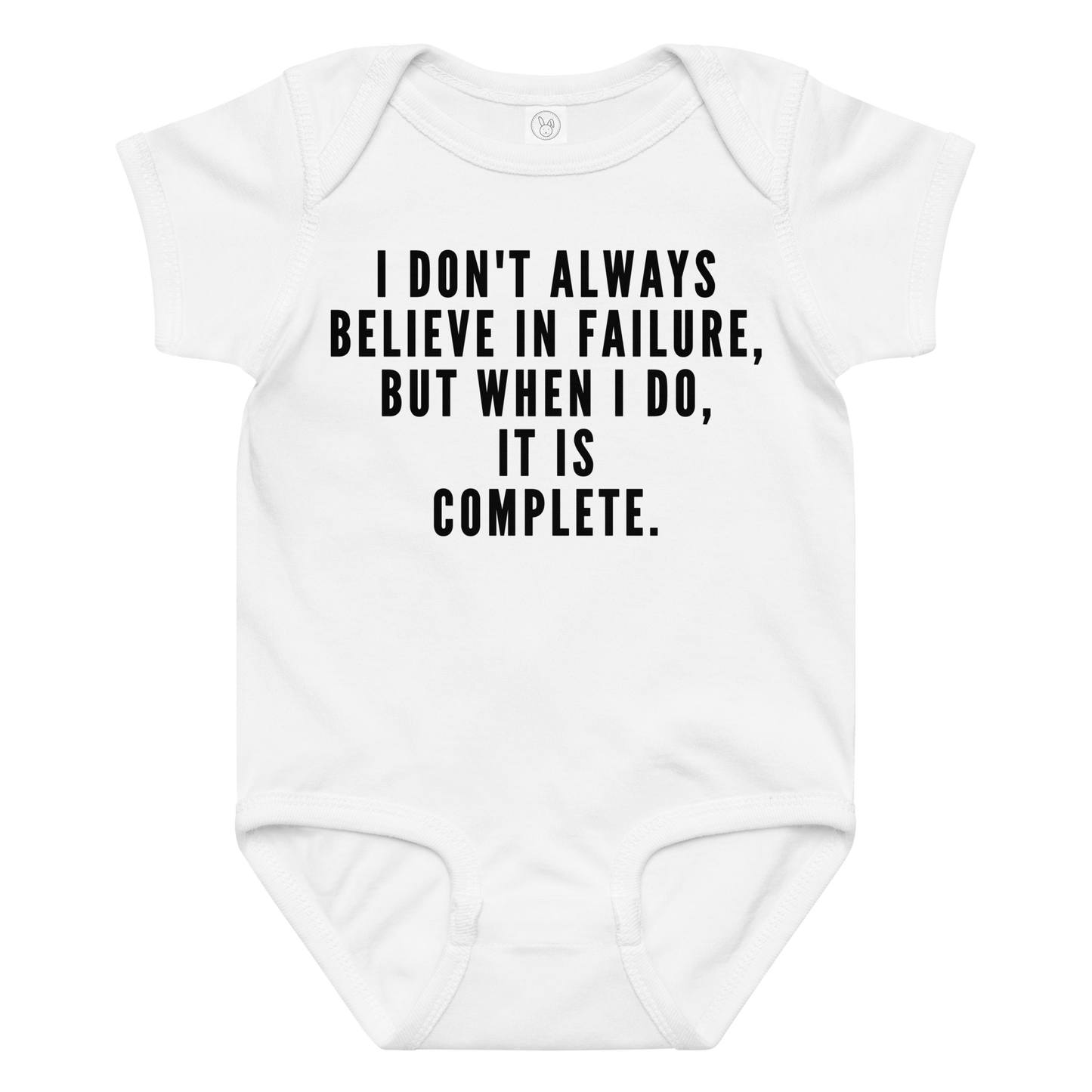 "I don't always believe in failure, but when I do, it is complete." printed on a white baby jersey bodysuit laying on a flat surface amongst other clothes