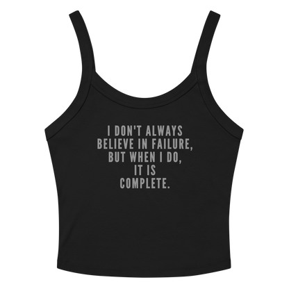 "I don't always believe in failure, but when I do, it is complete." printed on a solid black blend women's micro-rib tanktop laying on a flat surface amongst sunglasses and shorts