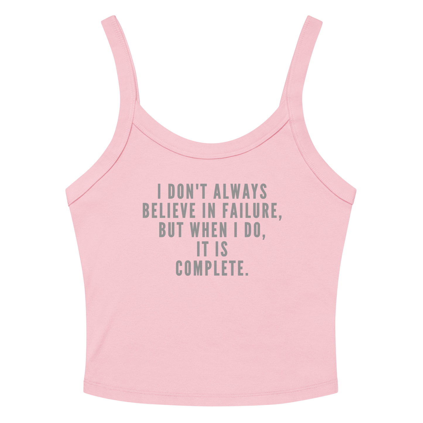 "I don't always believe in failure, but when I do, it is complete." printed on a solid pink blend women's micro-rib tanktop laying on a flat surface amongst sunglasses and shorts