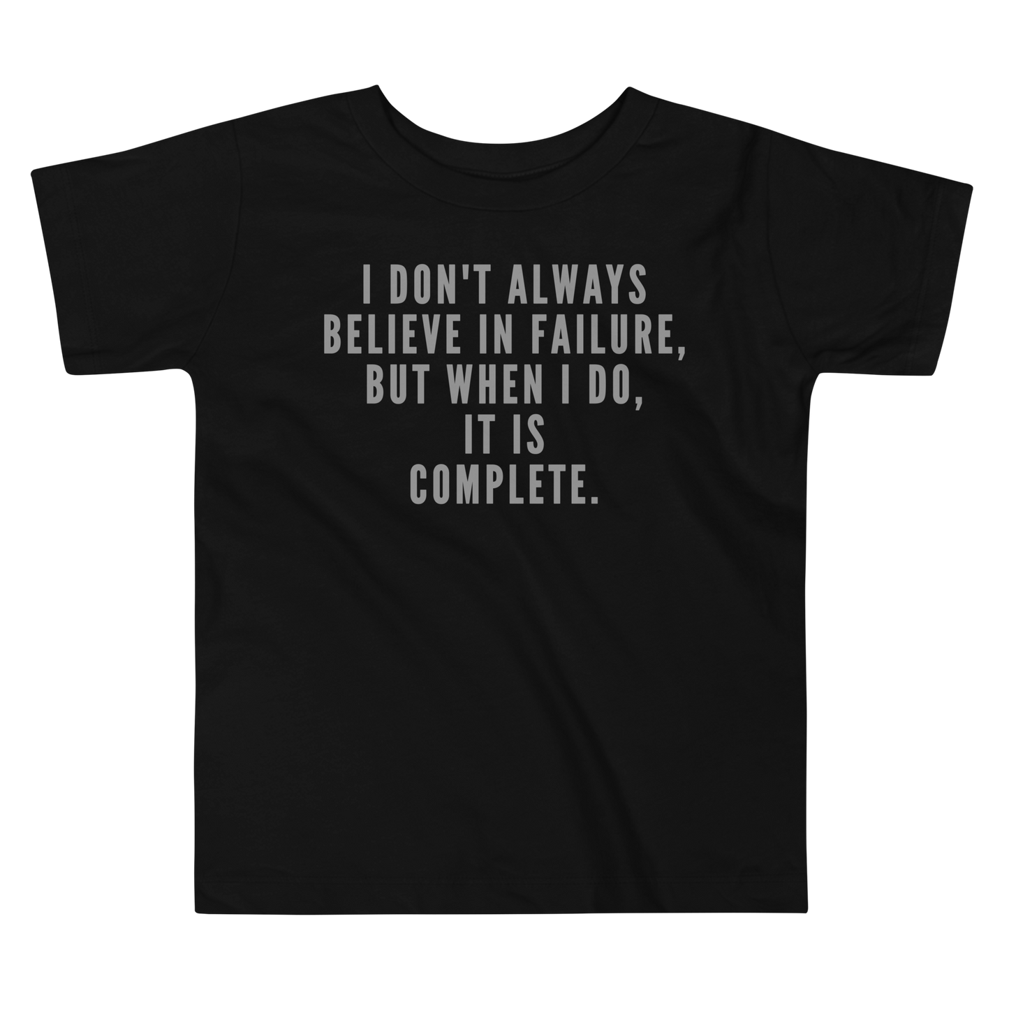 "I don't always believe in failure, but when I do, it is complete." printed on a black toddler short sleeve tee laying on a flat surface