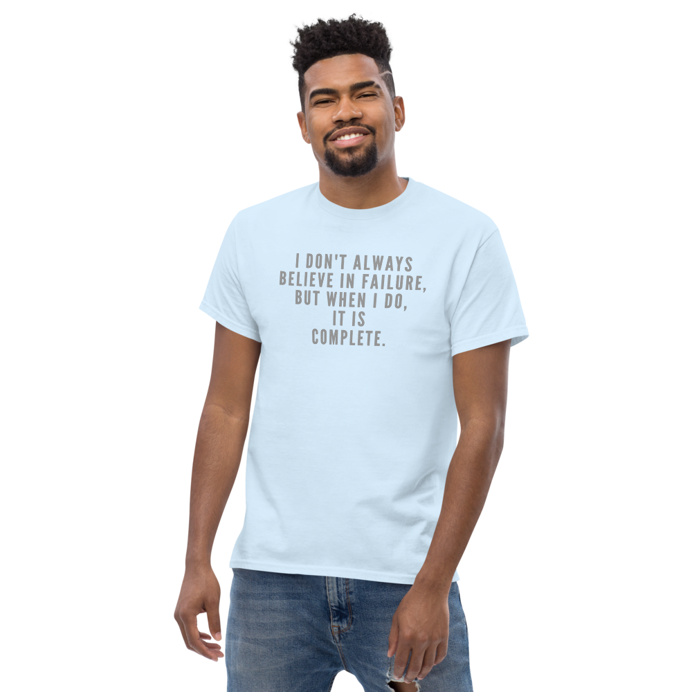 "I don't always believe in failure, but when I do, it is complete." printed on a light blue unisex classic tee worn by a male