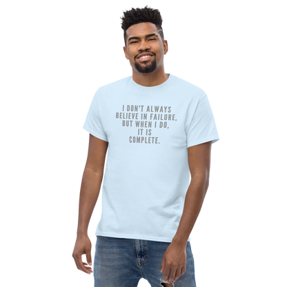 "I don't always believe in failure, but when I do, it is complete." printed on a light blue unisex classic tee worn by a male