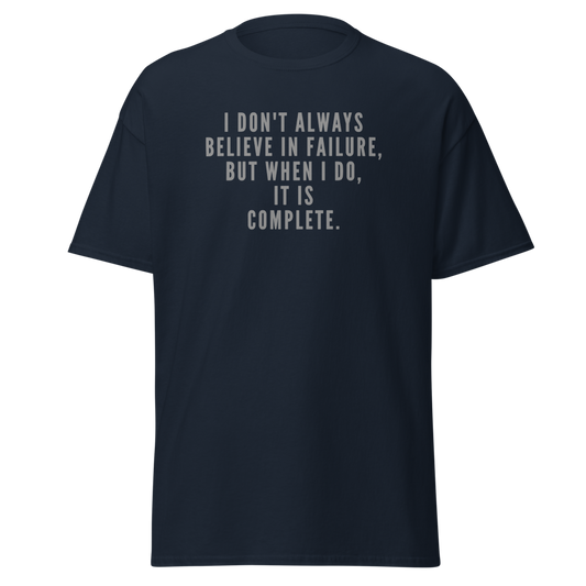 "I don't always believe in failure, but when I do, it is complete." printed on a navy unisex classic tee laying on a flat surface