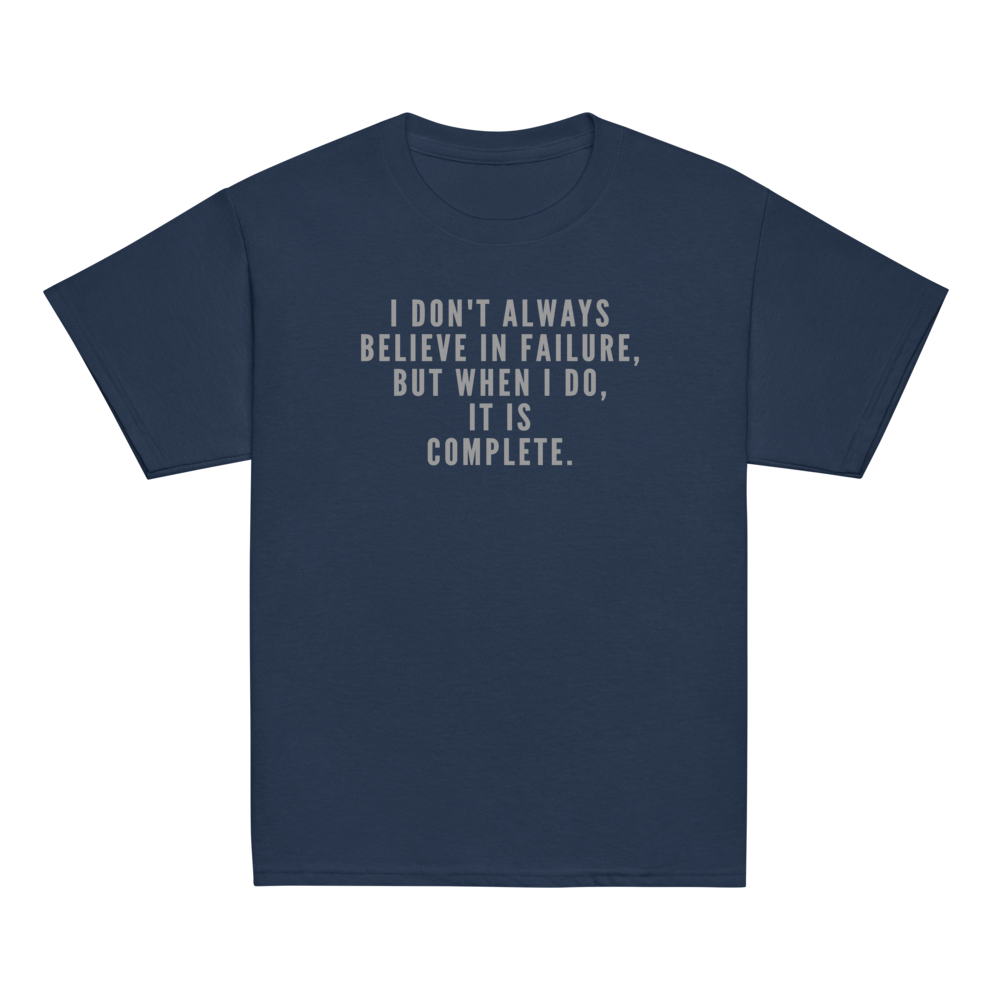 "I don't always believe in failure, but when I do, it is complete." printed on a navy youth classic tee laying on a flat surface