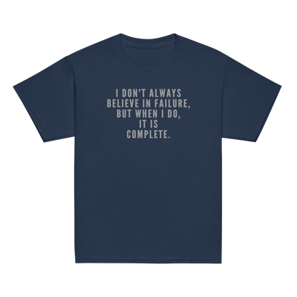 "I don't always believe in failure, but when I do, it is complete." printed on a navy youth classic tee laying on a flat surface