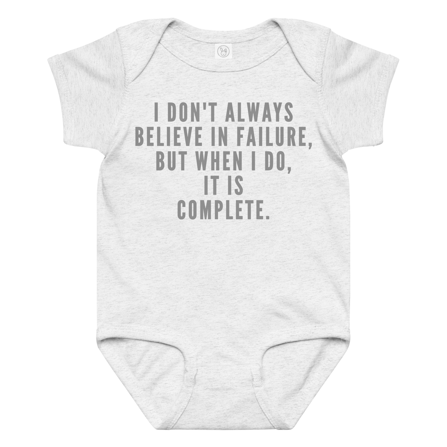 "I don't always believe in failure, but when I do, it is complete." printed on a ash baby jersey bodysuit laying on a flat surface amongst other clothes