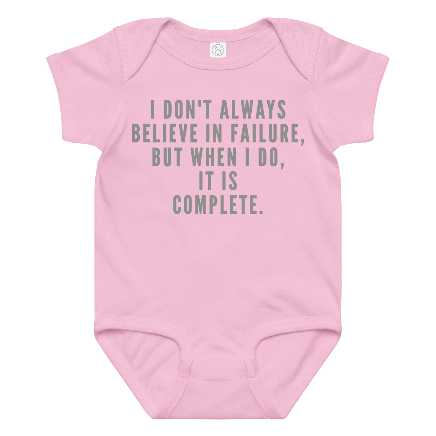 "I don't always believe in failure, but when I do, it is complete." printed on a pink baby jersey bodysuit laying on a flat surface amongst other clothes