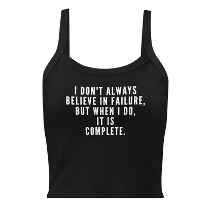 "I don't always believe in failure, but when I do, it is complete." printed on a solid black blend women's micro-rib tanktop laying on a flat surface