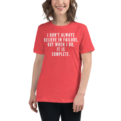 "I don't always believe in failure, but when I do, it is complete." printed on a heather red women's relaxed t-shirt worn by a female