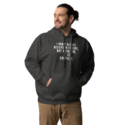 "I don't always believe in failure, but when I do, it is complete." printed on a charcoal heather unisex hoodie worn by a male