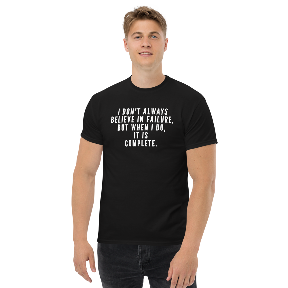"I don't always believe in failure, but when I do, it is complete." printed on a black unisex classic tee worn by a male