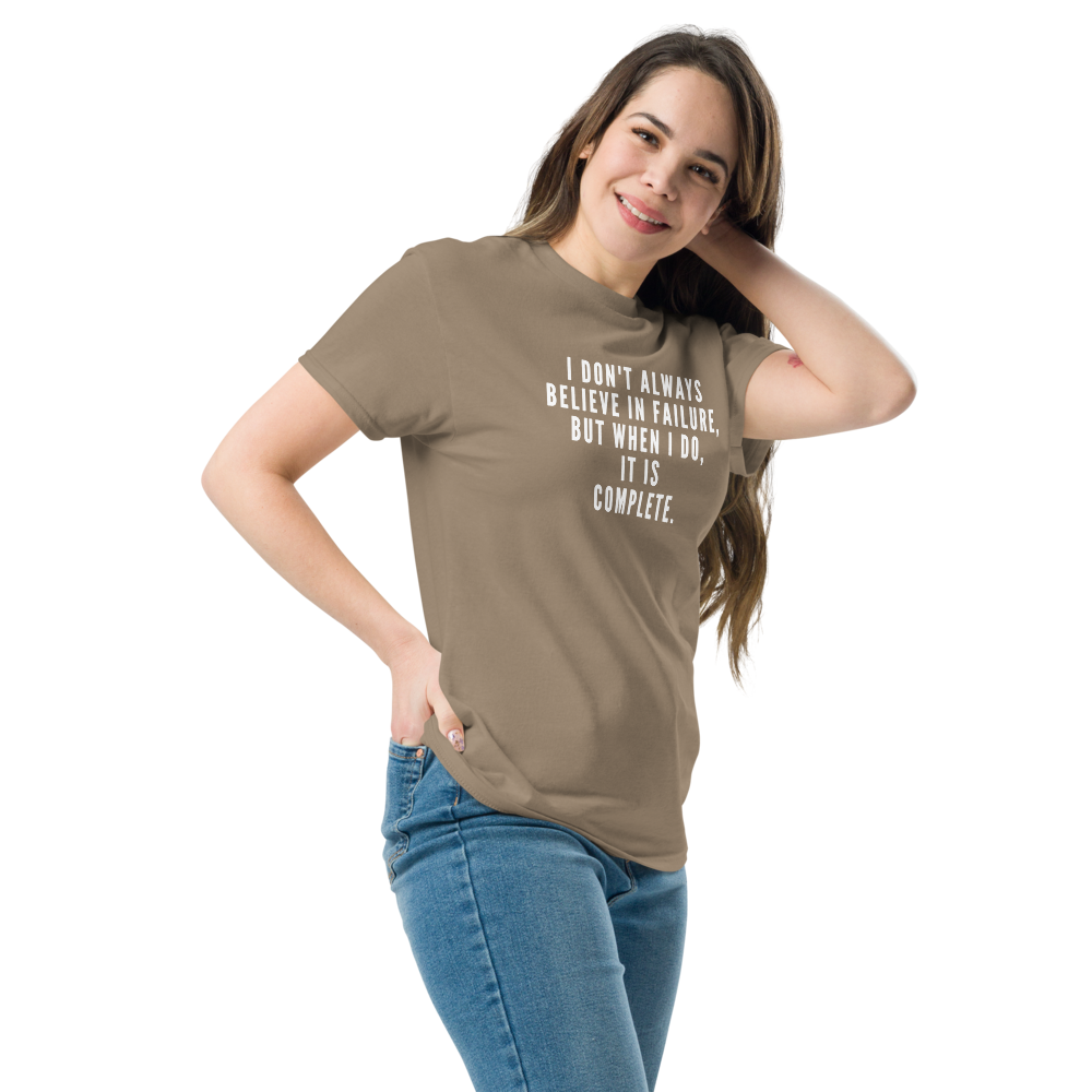 "I don't always believe in failure, but when I do, it is complete." printed on a brown savana unisex classic tee worn by a female