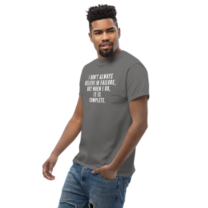 "I don't always believe in failure, but when I do, it is complete." printed on a charcoal unisex classic tee worn by a male