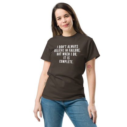 "I don't always believe in failure, but when I do, it is complete." printed on a dark chocolate unisex classic tee worn by a female