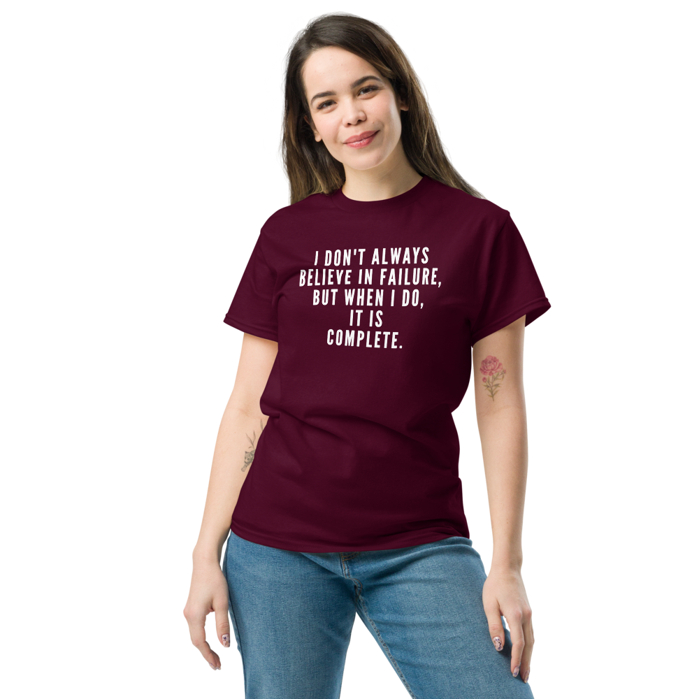 "I don't always believe in failure, but when I do, it is complete." printed on a maroon unisex classic tee worn by a female