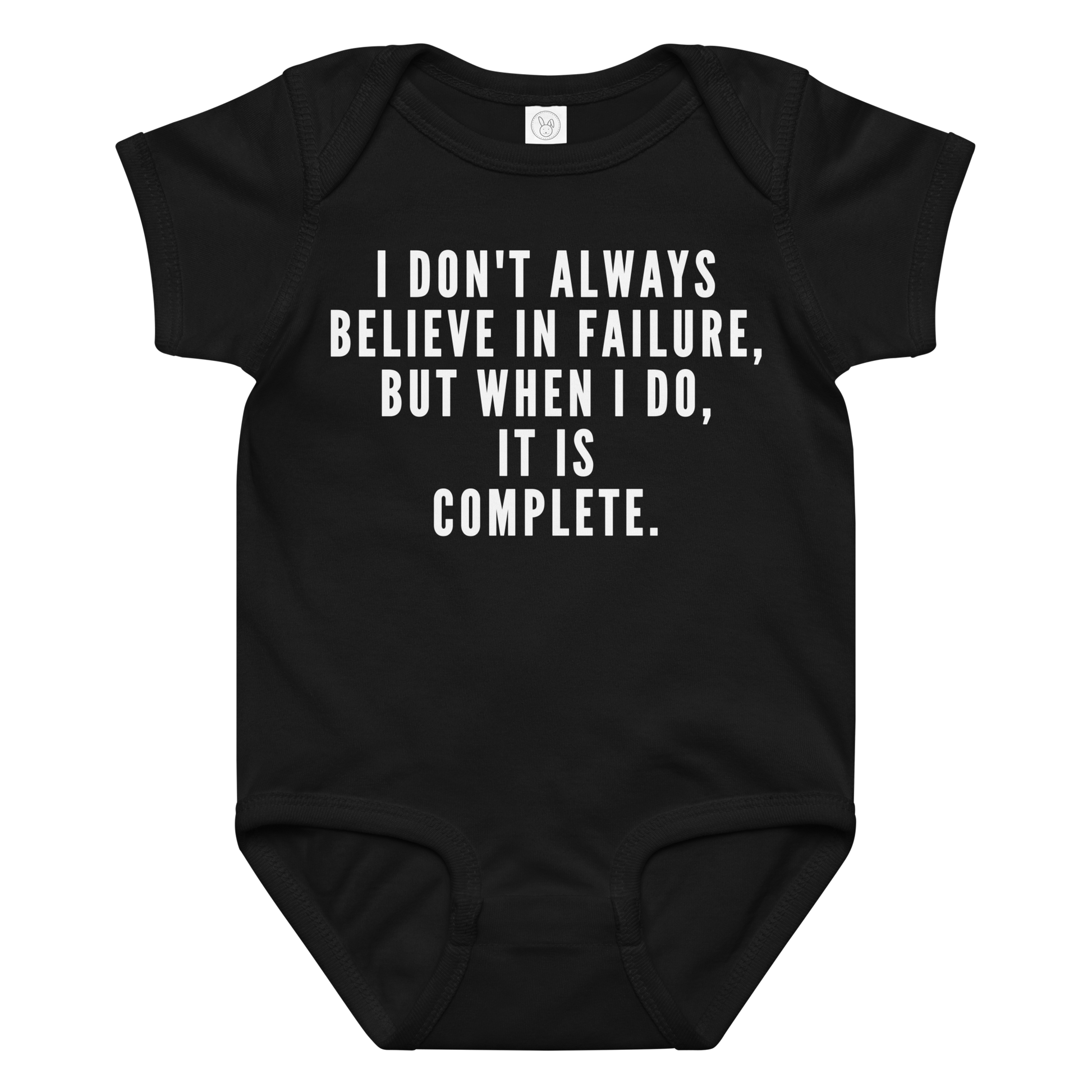 "I don't always believe in failure, but when I do, it is complete." printed on a black baby jersey bodysuit laying on a flat surface amongst other clothes