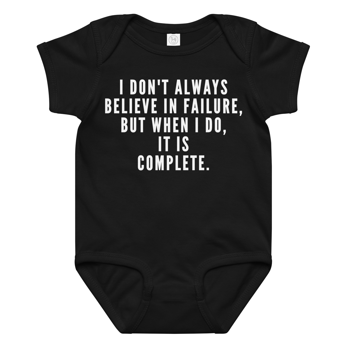 "I don't always believe in failure, but when I do, it is complete." printed on a black baby jersey bodysuit laying on a flat surface amongst other clothes