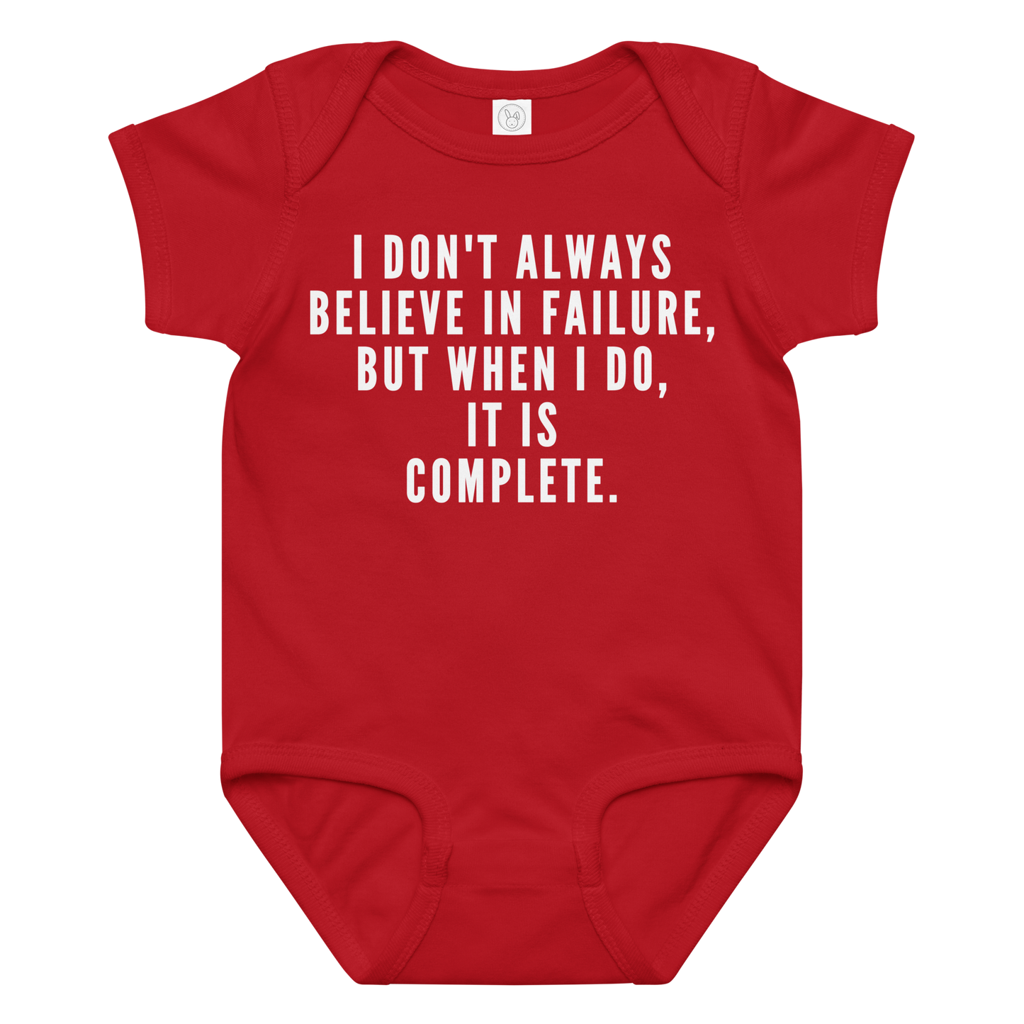 "I don't always believe in failure, but when I do, it is complete." printed on a red baby jersey bodysuit laying on a flat surface amongst other clothes