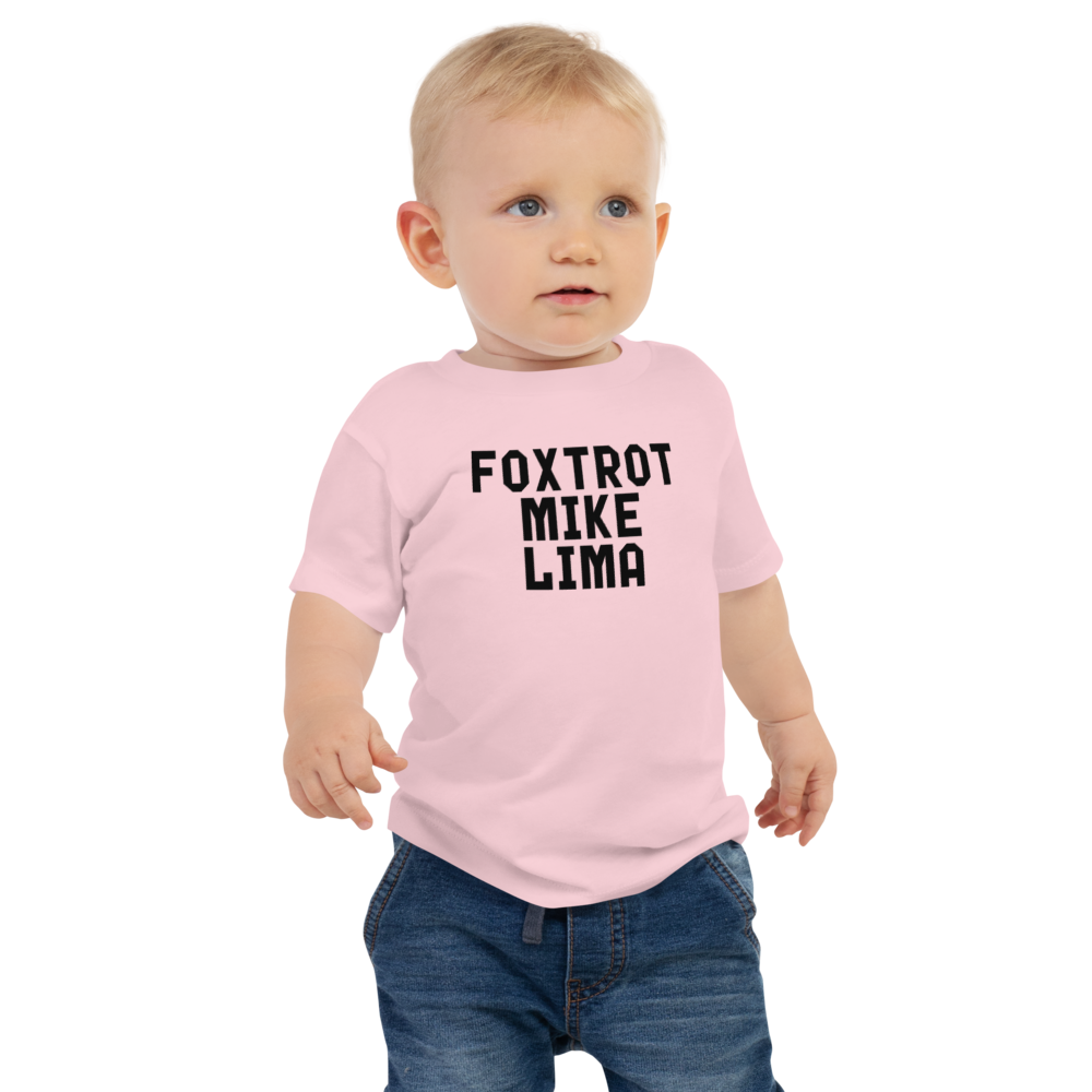 "Foxtrot Mike Lima" printed on a pink baby jersey short sleeve tee worn by a male