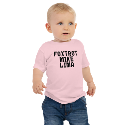 "Foxtrot Mike Lima" printed on a pink baby jersey short sleeve tee worn by a male