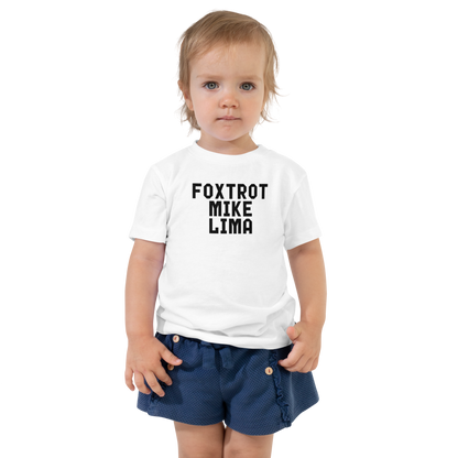 "Foxtrot Mike Lima" printed on a white toddler short sleeve tee worn by a female
