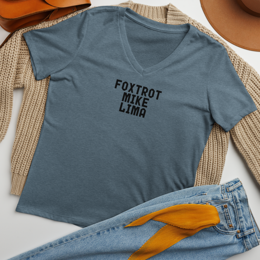 "Foxtrot Mike Lima" printed on a heather slate women's relaxed v-neck t-shirt laying on a flat surface amongst other clothes