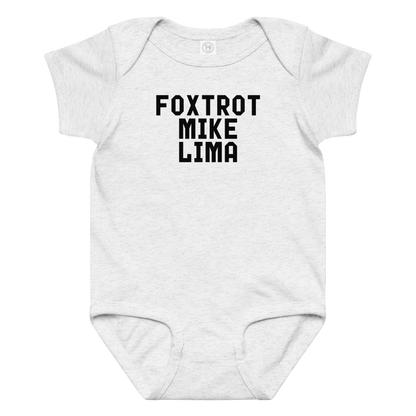 "Foxtrot Mike Lima" printed on a ash baby jersey bodysuit laying on a flat surface amongst other clothes