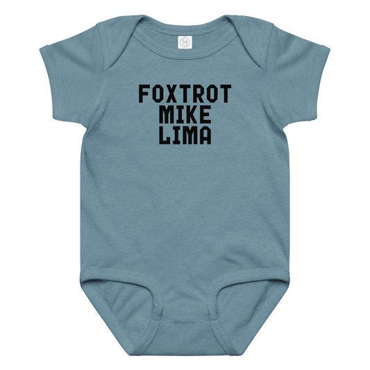 "Foxtrot Mike Lima" printed on a vintage indigo baby jersey bodysuit laying on a flat surface amongst other clothes
