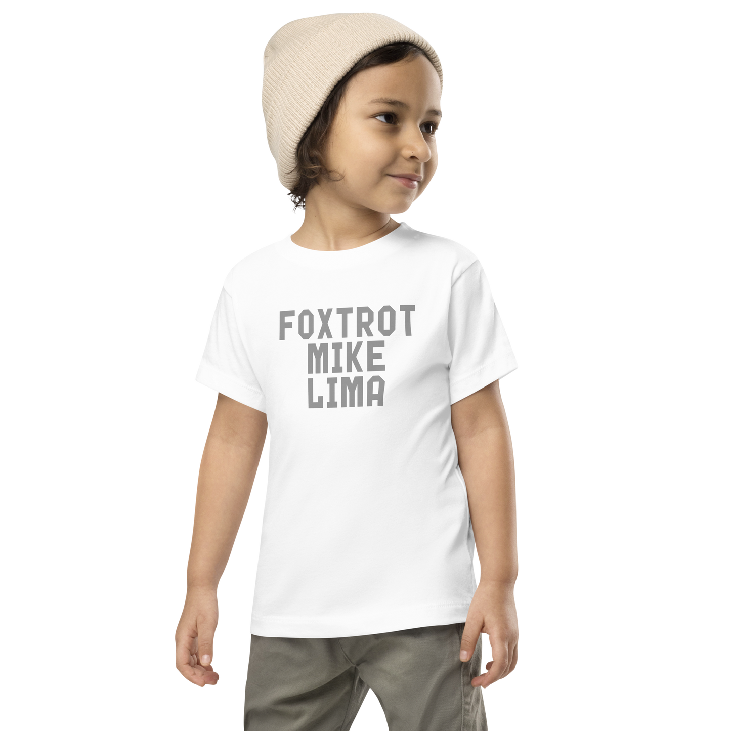 "Foxtrot Mike Lima" printed on a white toddler short sleeve tee worn by a male wearing a cap