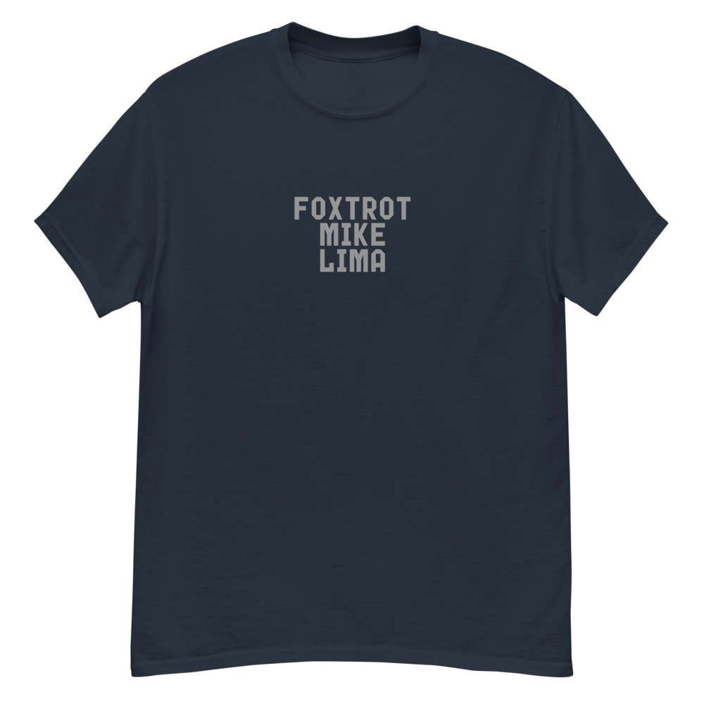 "Foxtrot Mike Lima" printed on a navy unisex classic tee laying on a flat surface