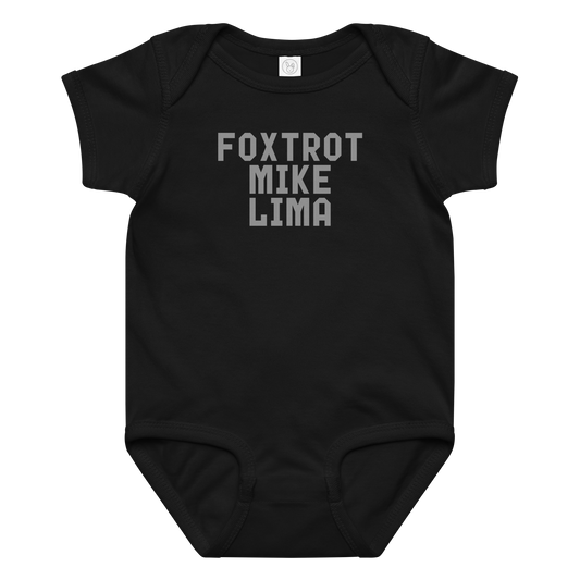 "Foxtrot Mike Lima" printed on a black baby jersey bodysuit laying on a flat surface amongst other clothes