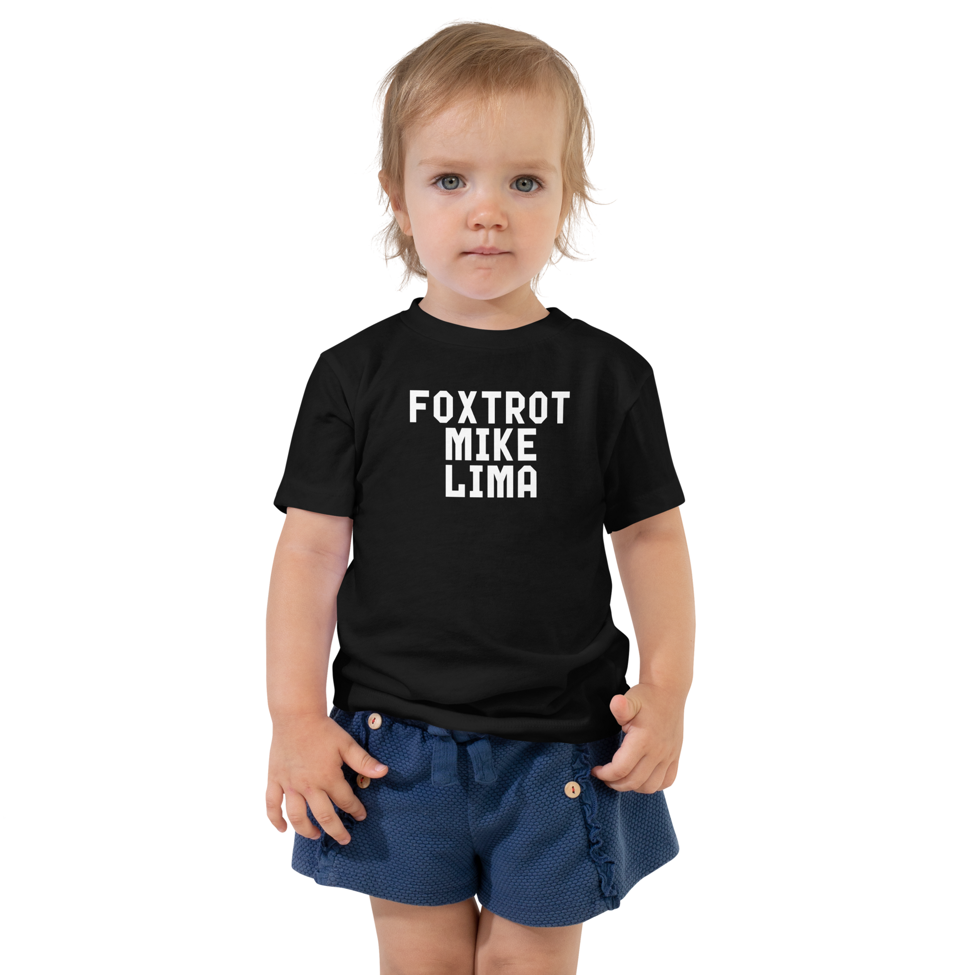 "Foxtrot Mike Lima" printed on a black toddler short sleeve tee worn by a female