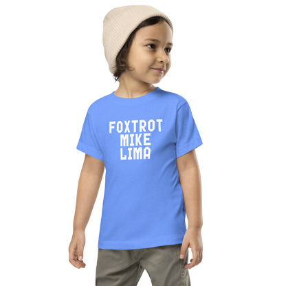 "Foxtrot Mike Lima" printed on a heather columbia blue toddler short sleeve tee worn by a male wearing a cap