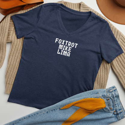 "Foxtrot Mike Lima" printed on a heather navy women's relaxed v-neck t-shirt laying on a flat surface amongst other clothes