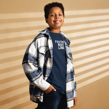 "Foxtrot Mike Lima" printed on a navy youth classic tee worn by a male also wearing a jacket