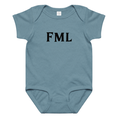 "FML" printed on a vintage indigo baby jersey bodysuit laying on a flat surface amongst other clothes