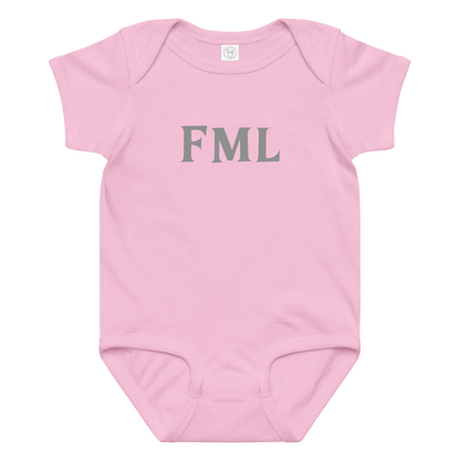 "FML" printed on a pink baby jersey bodysuit laying on a flat surface amongst other clothes