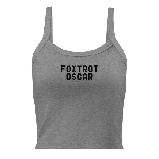 "Foxtrot Oscar" printed on a athletic heather women's micro-rib tanktop laying on a flat surface