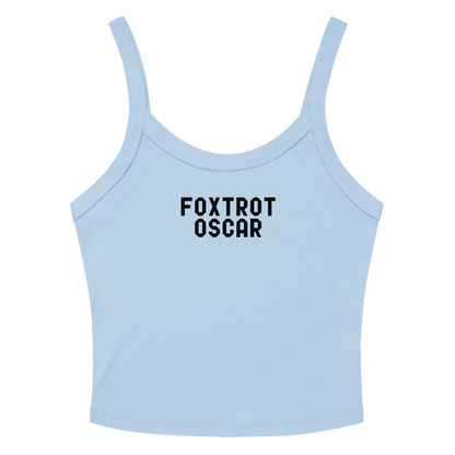 "Foxtrot Oscar" printed on a solid baby blue blend women's micro-rib tanktop laying on a flat surface amongst sunglasses and shorts