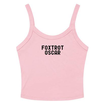 "Foxtrot Oscar" printed on a solid pink blend women's micro-rib tanktop laying on a flat surface amongst sunglasses and shorts