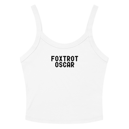 "Foxtrot Oscar" printed on a solid white blend women's micro-rib tanktop laying on a flat surface amongst sunglasses and shorts