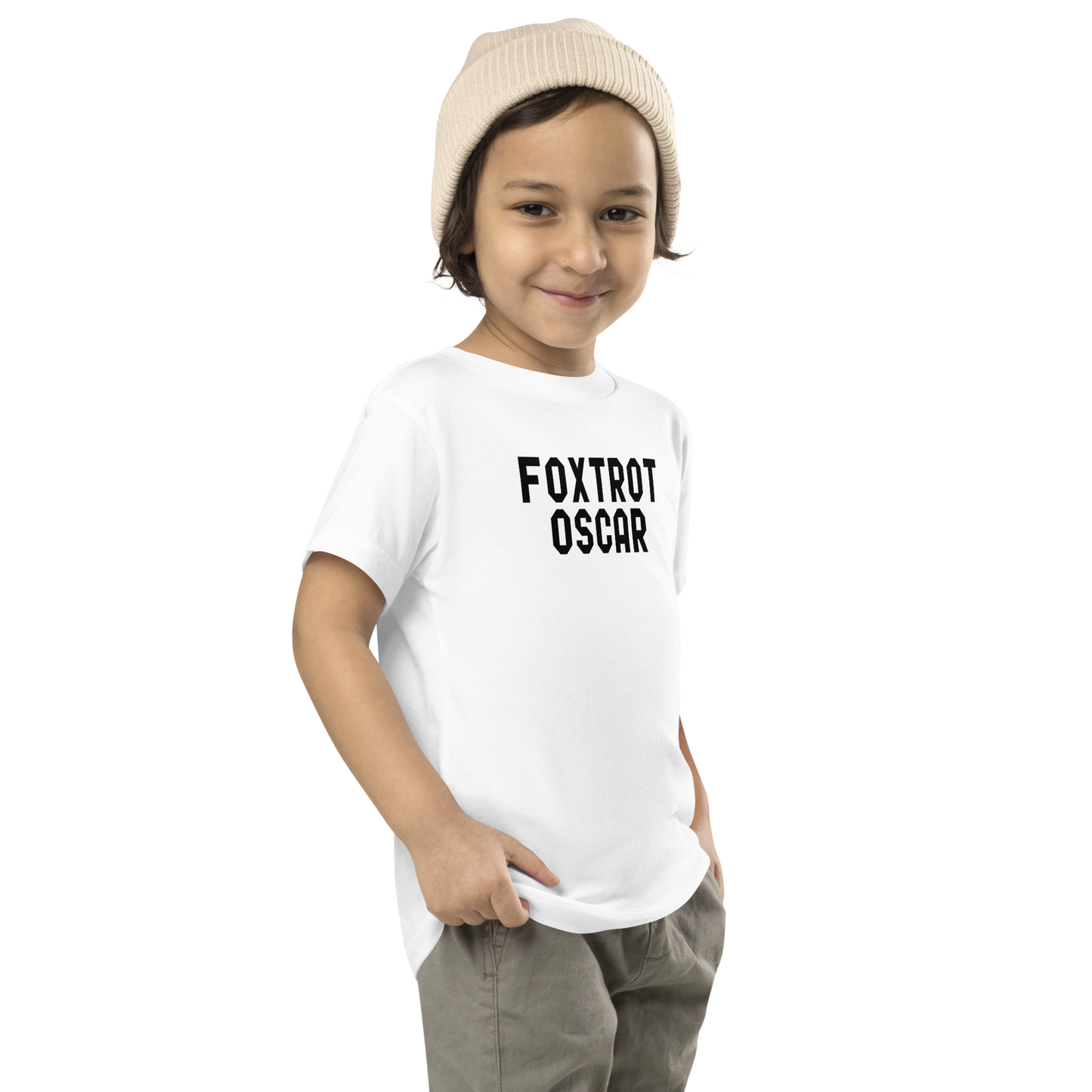 "Foxtrot Oscar" printed on a white toddler short sleeve tee worn by a male who is also wearing a knit cap