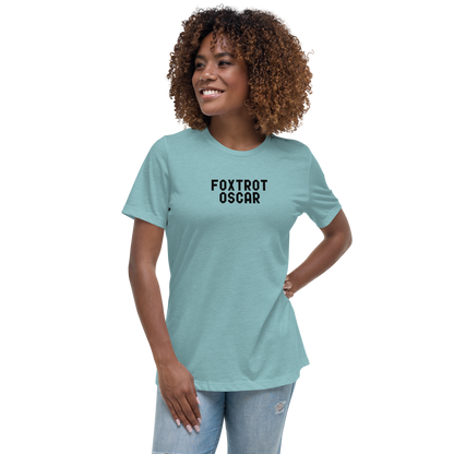 "Foxtrot Oscar" printed on a heather blue lagoon women's relaxed t-shirt worn by a female