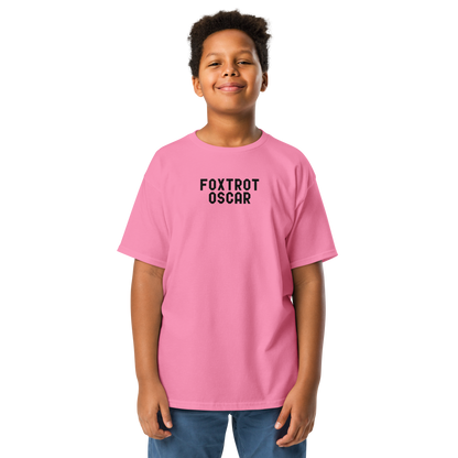 "Foxtrot Oscar" printed on a azalea youth classic tee worn by a male