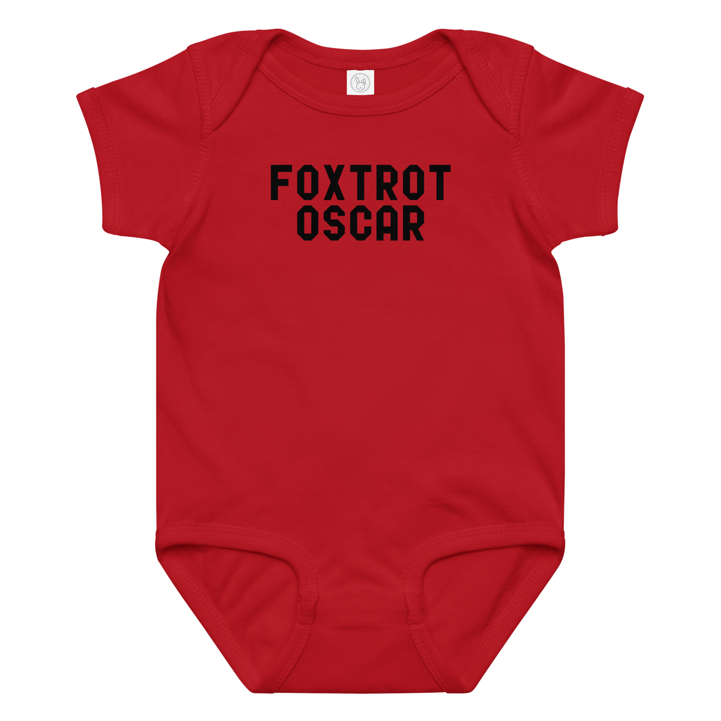 "Foxtrot Oscar" printed on a red baby jersey bodysuit laying on a flat surface amongst other clothes