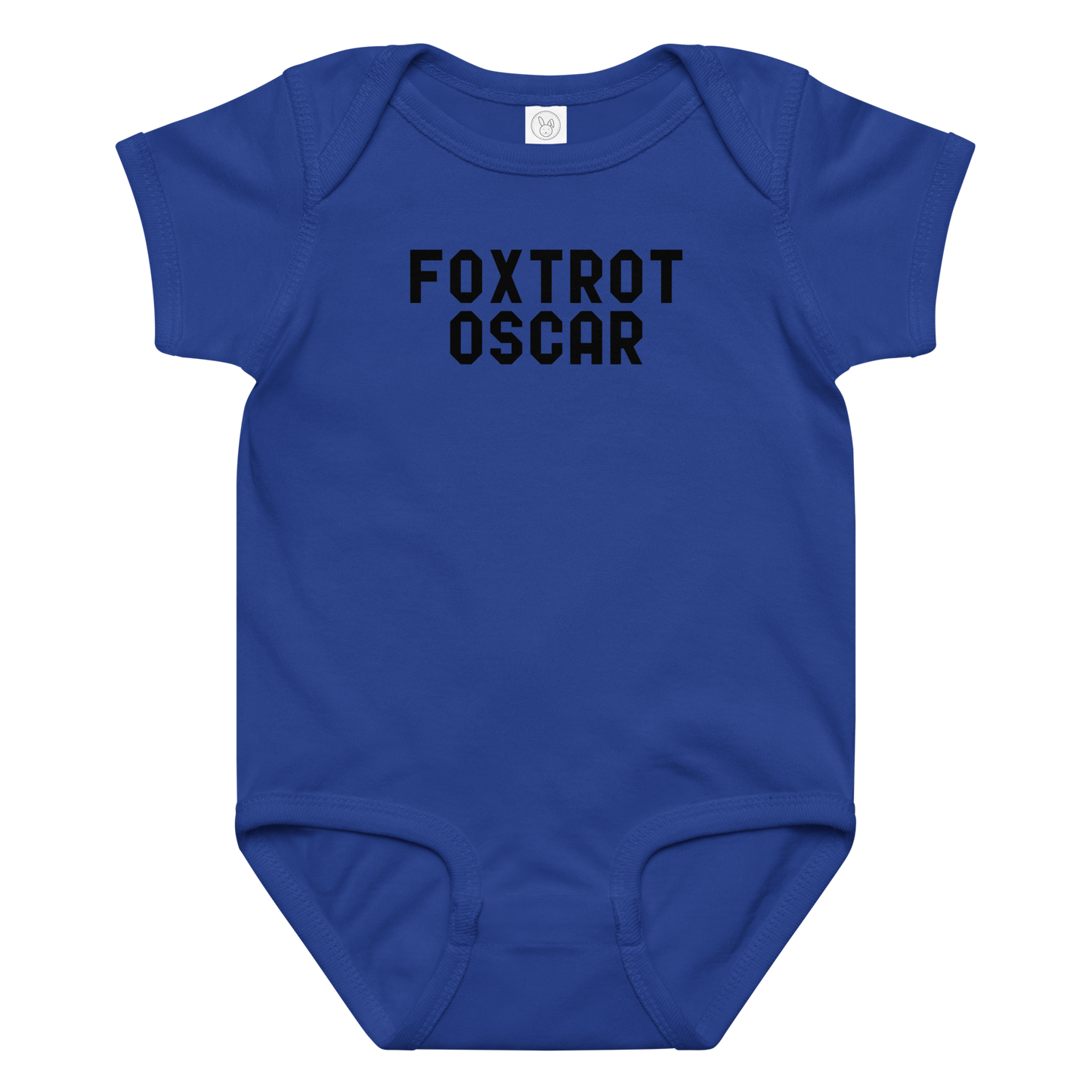"Foxtrot Oscar" printed on a royal baby jersey bodysuit laying on a flat surface amongst other clothes