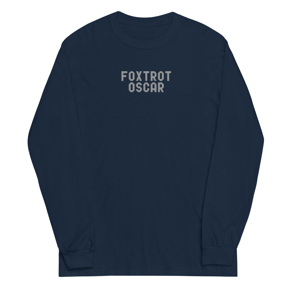"Foxtrot Oscar" printed on a navy men's long sleeve shirt laying on a flat surface